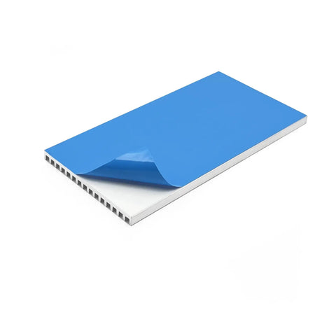 Close-up of Dope Ultra Slim Aluminum Heatsink Kit 100x50x4mm with pre-applied blue thermal conductive tape for passive cooling