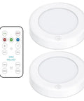 Stick On LED Puck Lights With Remote, Battery Powered Wireless Cabinet Lighting, 2 Pack, shown with remote control, white design