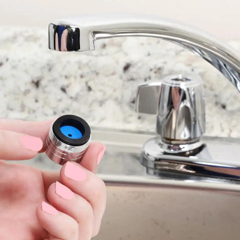 Hand holding Dual Thread Water Saving 1.5 GPM Aerator In Chrome Fits 15/16 Inch 27M Or 55/64 Inch 27F Watersense Certified