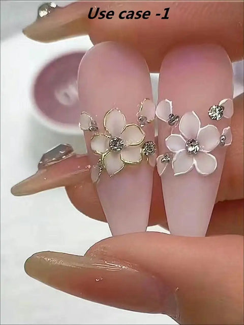 Pro Grade Dual Ended Nail Art Tool Set in use with floral rhinestone design on acrylic nails.