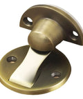 Solid Green Bronze Magnetic Door Stopper Wall Or Floor Mounted Catch For Homes Offices Keeps Doors From Slamming Smoothly And Quietly Every Time You Walk Through, close-up view of bronze door catcher.