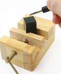 Claky Wood Working Flat Pliers And Vise Clamp For Table Bench Seal holding a wood piece steady while engraving with a tool.