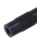 Close-up of Portable 13cm Emergency Fire Piston Fire Starter with black metal body and textured grip, Pocket Sized Survival Gear.
