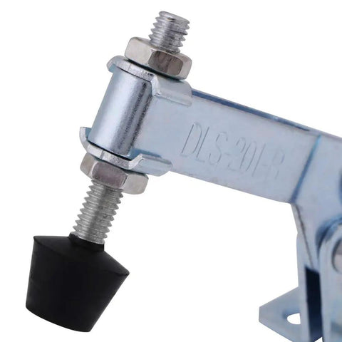 Heavy Duty 4 Pcs Toggle Clamp Set With Quick Release Lever And Super Secure Holding Power For Woodworking Welding Assembly and Shop Tasks. Close-up of the zinc-coated clamp mechanism.