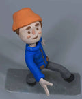 Clay puppet figure on a heavy duty anti tip metal base stop motion shooting bracket with interchangeable brass fixtures for DIY animation.