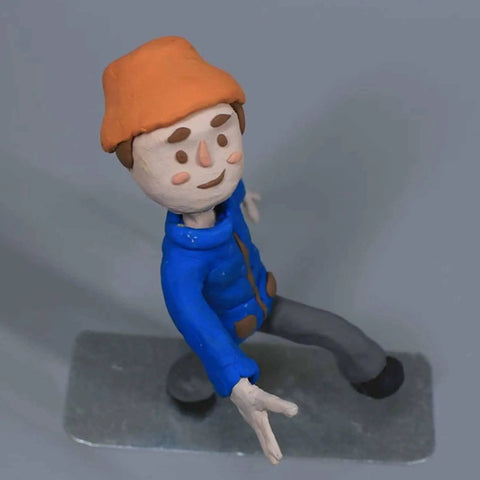 Clay puppet figure on a heavy duty anti tip metal base stop motion shooting bracket with interchangeable brass fixtures for DIY animation.