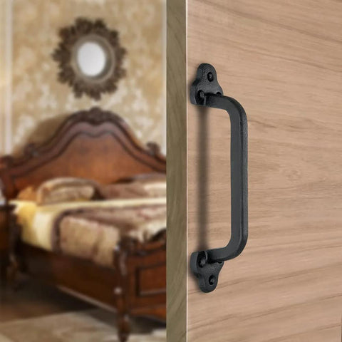 Rustic 9 Inch Cast Iron Sliding Barn Door Handle 2 Pack Black Vintage Gate Pull installed on wooden interior door