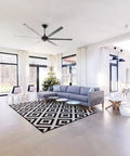 Keep It Chill With This Dope 84 Inch Smart Ceiling Fan Engineered For Indoor Or Outdoor Zones With Whisper Quiet Motors Alexa Connectivity Bluetooth Senseme Tech And Sleek Black Finish For Spacious Family Gatherings At Home in a modern living room setting.