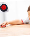 Child playing with toy car beside 8 Pack Toy Car Wheels Set With Anti Skid Plastic Tires For RC Cars And Model Toys display