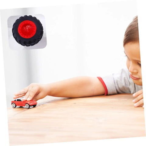 Child playing with toy car beside 8 Pack Toy Car Wheels Set With Anti Skid Plastic Tires For RC Cars And Model Toys display