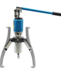 Thinking Process: three-jaw bearing puller tool with blue handle, metal jaws, for shaft and gear removal