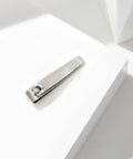 Stainless Steel Fingernail Clipper With Curved Blade For Precise Nail Trimming And Sharp Cutting Edges Durable Pro Grade Manicure Tool For Easy At Home Nail Care Everyday Use Anywhere, silver clipper on white surface