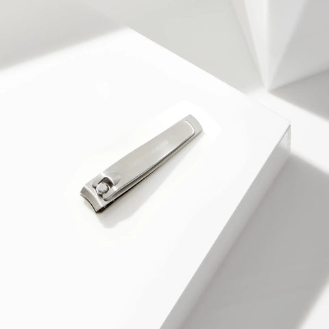 Stainless Steel Fingernail Clipper With Curved Blade For Precise Nail Trimming And Sharp Cutting Edges Durable Pro Grade Manicure Tool For Easy At Home Nail Care Everyday Use Anywhere, silver clipper on white surface