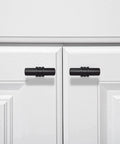 2 Pack Matte Black Cabinet Pulls T Bar Knobs For Kitchen Cupboards And Bathroom Cabinets installed on white doors