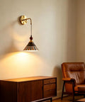DWEIHDV Ceramic Wall Sconce Vintage Gold Wall Light Fixture in a cozy living room, featuring a hand-painted striped shade.