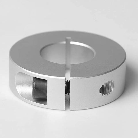 Close-up of a single aluminum shaft collar from 4 Pack Aluminum Shaft Collar Clamp Kit For 10mm Bore Shafts, 30mm Outside Diameter, 10mm Thick, M4 Set Screws, Lightweight Non-Marring Grip, Easy Install For Shaft Fixing And Positioning On Linear Slides on a gray background.
