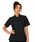 Womens Short Sleeve Double Breasted Black Chef Coat Featuring Ten Pearl Buttons And Tailored Kitchen Fit, model wearing chef coat.