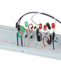 Breadboard with All In One Aluminum Electrolytic Capacitor Kit With 630 Pieces And 24 Values From 0.1uF To 1000uF in use