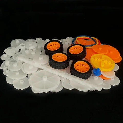 164 Piece Plastic Gear Set For RC Cars And DIY Robots Includes Single And Double Gears Belts Shafts on black background