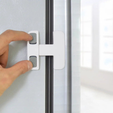 Hand installing kidproof fridge lock for cabinets and drawers with flexible strap, no tools needed, on a fridge door.