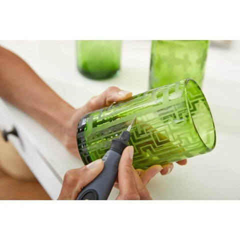 Dremel 729-01 11-piece carving/engraving micro kit; handheld rotary tool engraving a green glass tumbler
