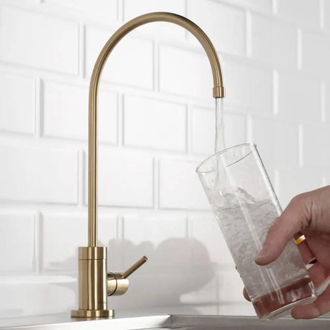 Kitchen Water Filter Faucet In Brushed Gold Standalone Beverage Faucet dispensing water into glass