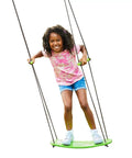 Child riding stand up tree swing for kids with adjustable handles, surf style kick swing, easy install outdoor swingset, green board