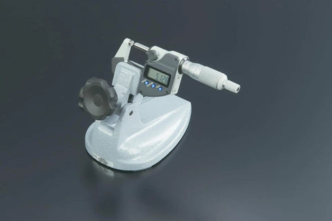 Pro Grade Micrometer Stand For Four Inch Micrometers With Large Clamp Knobs shown with digital micrometer on dark surface