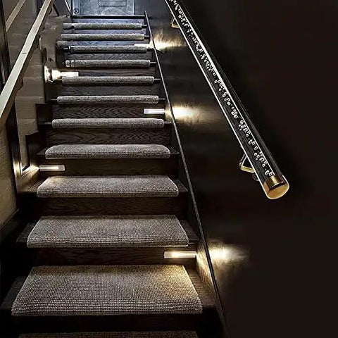 Clear Acrylic Stair Rail With Elegant Gold Brackets Adjustable Handrail Kit For Indoor Outdoor Rooms Slick Look Top Shelf Home Flex Easy Install Four Point Five Feet mounted alongside illuminated stair treads.