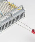 Jonard Tools Jic-2257M Metal Wire Loop Puller With Red Anodized Aluminum Handle, 8-1/2" Length in use on terminal block.