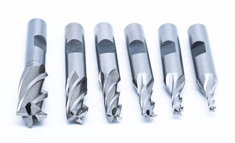 Six-piece set of center-cutting, 4-flute end mills in steel; sizes 1/8–1/2 in with 3/8 in shank.