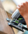 Person using Cordless Barrel Grip Jigsaw Carvex PSC 420 EB Basic No Battery Or Charger Included for precision cuts on wood