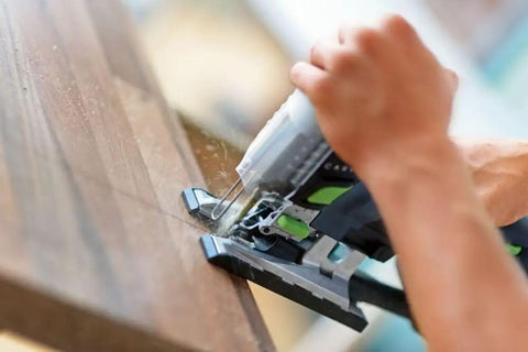 Person using Cordless Barrel Grip Jigsaw Carvex PSC 420 EB Basic No Battery Or Charger Included for precision cuts on wood