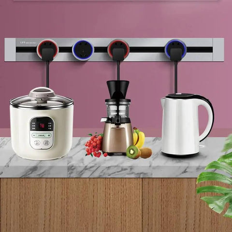 Sleek Concealed Power Track Socket Offering Four Dedicated Plug Outlets For Lowkey Kitchen Counter Organization And Modern Home Electrical Flexing Heavy Duty Sandblasted Aluminum Finish with appliances on marble countertop.