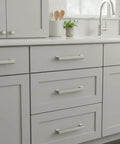 15 Pack Brushed Satin Nickel Cabinet Pulls With 3 Inch Hole Centers Slick Kitchen Cabinet Handles For Cabinets Drawers And Closets Durable Aluminum Pulls AL3071SN installed on gray kitchen cabinets