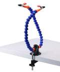 Two Arm Third Hand Soldering Station with flexible blue arms and non-slip clamp attached to a table edge for PCB work.