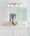 4-Light Brass Vanity Light With Milky White Glass Globes, Modern Wall Fixture For Bathroom Or Powder Room, Brushed Brass Finish