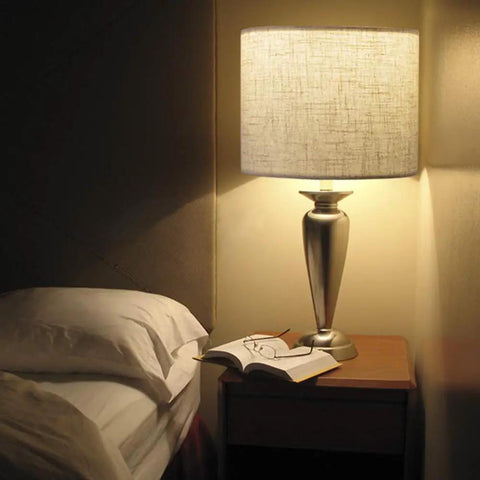DIY Linen Drum Lamp Shade 13 Inch Top 13 Inch Bottom 10 Inch High Easy To Set Up For Table Lamp Bedside Lamp And Floor Lamp Fabric Replacement Lampshade With Spider Fitter Classic Modern Style shown on a bedside table.
