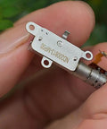 Mini 5mm Stroke Linear Actuator 2 Phase 4 Wire Stepper Motor With Precision Metal Gearbox held in hand, showing detailed components.