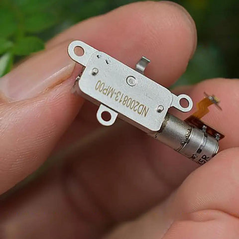 Mini 5mm Stroke Linear Actuator 2 Phase 4 Wire Stepper Motor With Precision Metal Gearbox held in hand, showing detailed components.