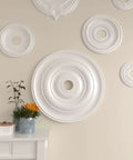 Jefferson Ceiling Medallion Perfect For Adding Gorgeous Architectural Detail To Your Ceiling This Factory Primed Piece Features A Twenty Six Inch Outer Diameter Fits Canopies Up To Five Inches For Quick And Easy Diy Install displayed on wall