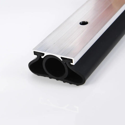 Close-up of Heavy Duty U O Ring Garage Door Bottom Seal Weatherstrip Kit with aluminum track retainer, black 10 ft, 1.25 in wide