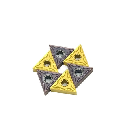 Five TNMG160404 carbide inserts in yellow and purple for the Top Tier Indexable Carbide Lathe Tool for tough metal jobs.