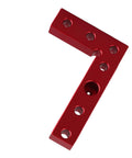 Red L-shaped tool with multiple holes resembling Orange Aluminum Alloy Self Centering Dowel Drill Guide And Center Scriber For Woodworking