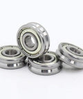 Top Shelf V Groove Sealed Ball Bearings With Badass Steel Core For Smooth Pulley Wheels And Guide Tracks Tough As Nails Precision Heavy Duty Four Pieces stacked on a white surface.