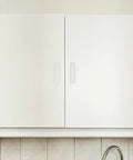 Top Grade No Hassle Self Adhesive Cabinet Handles Pair White Pp Drawer Knobs mounted on white cabinet doors.