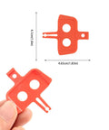 Close-up of red plastic piece from 8 Piece Bike Disc Brake Pad Spacer Set for Hydraulic Systems Go To Spreader Insert Tool Shimano Compatible