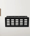 Badass Wall Mounted Caulk Tube Organizer Rack With 11 Hella Durable Slots For No Sweat Storage And Quick Install Sweet For Garage Or Shop Smooth Edge Frame Keeps Your Tools Tidy And Always Ready, black metal design on white wall.