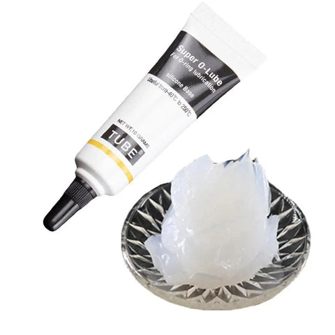 Ultra Gritty Multi Use Silicone Grease For O Rings Plumbing And Rubber Seals Offers Waterproof Protection in a tube next to lubricant.