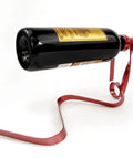 Wine Bottle Holder Rack For Cabinet And Table Decor holding a bottle, red metal design, modern rustic style for home bar display